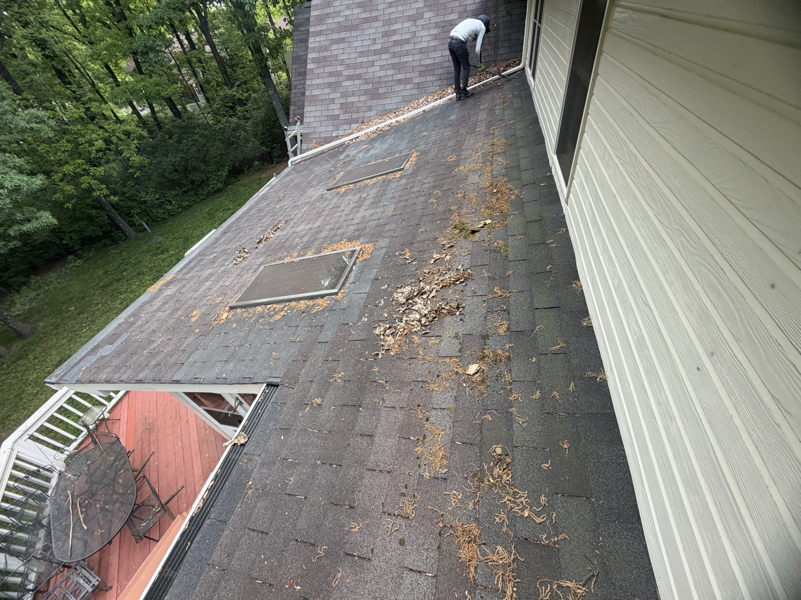 Fresh asphalt shingle installation in progress