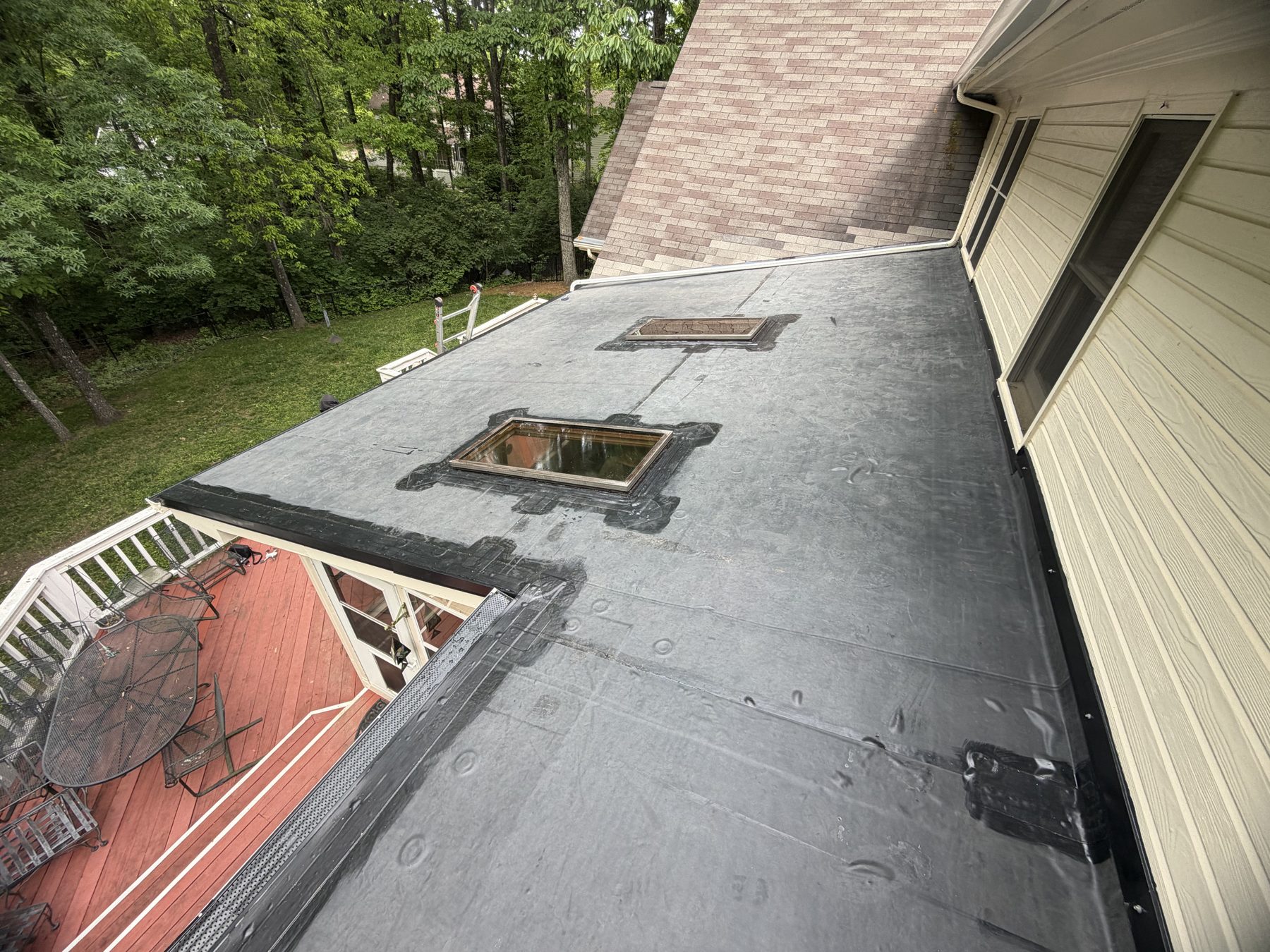 Finished low-slope membrane roof with skylights installed by HB Contracting