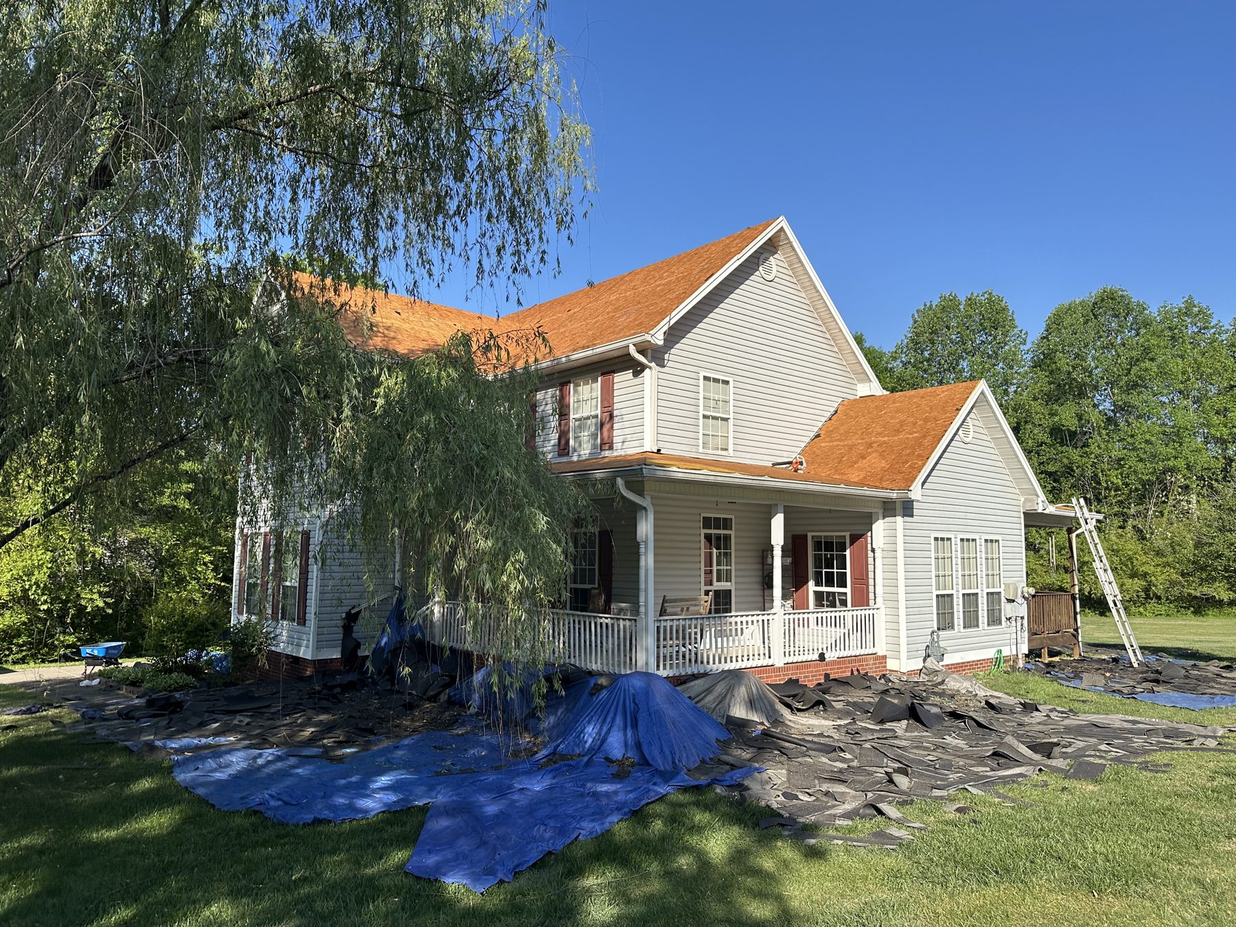 Country farmhouse with a fresh roof replacement project by HB Contracting