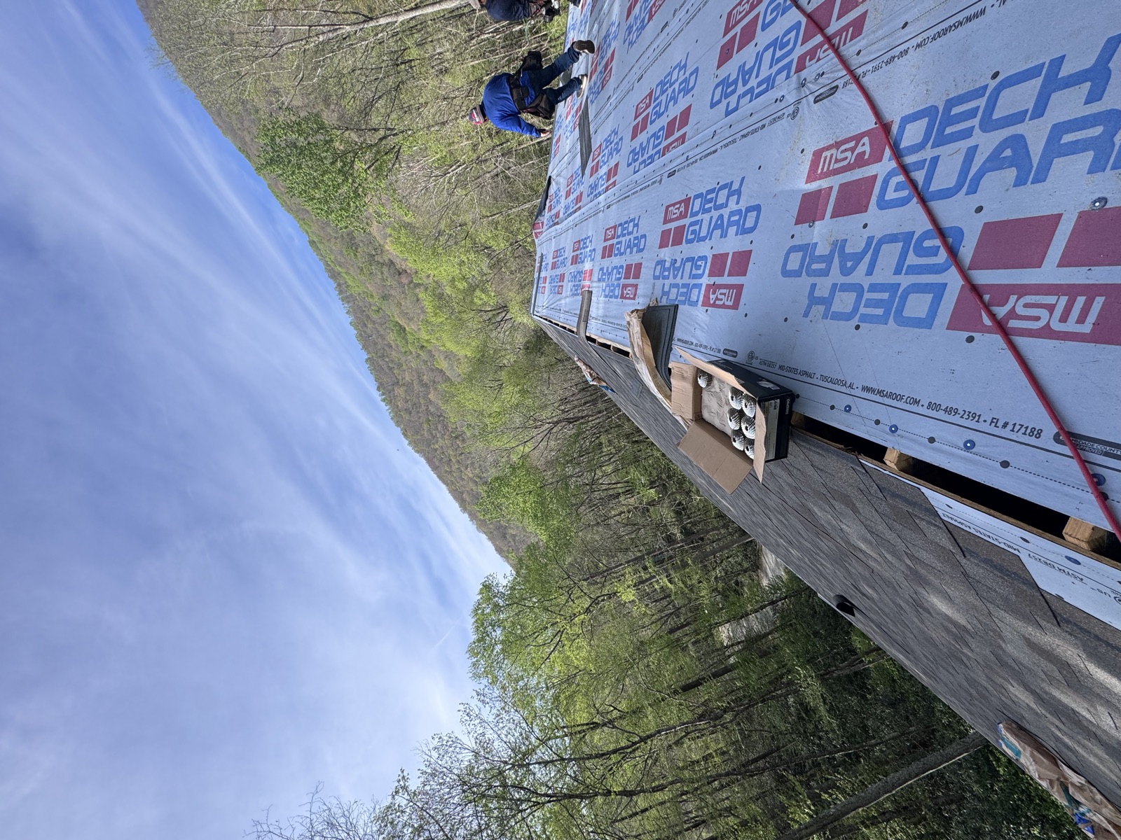 Roofing team working along the ridge of a Chattanooga roof