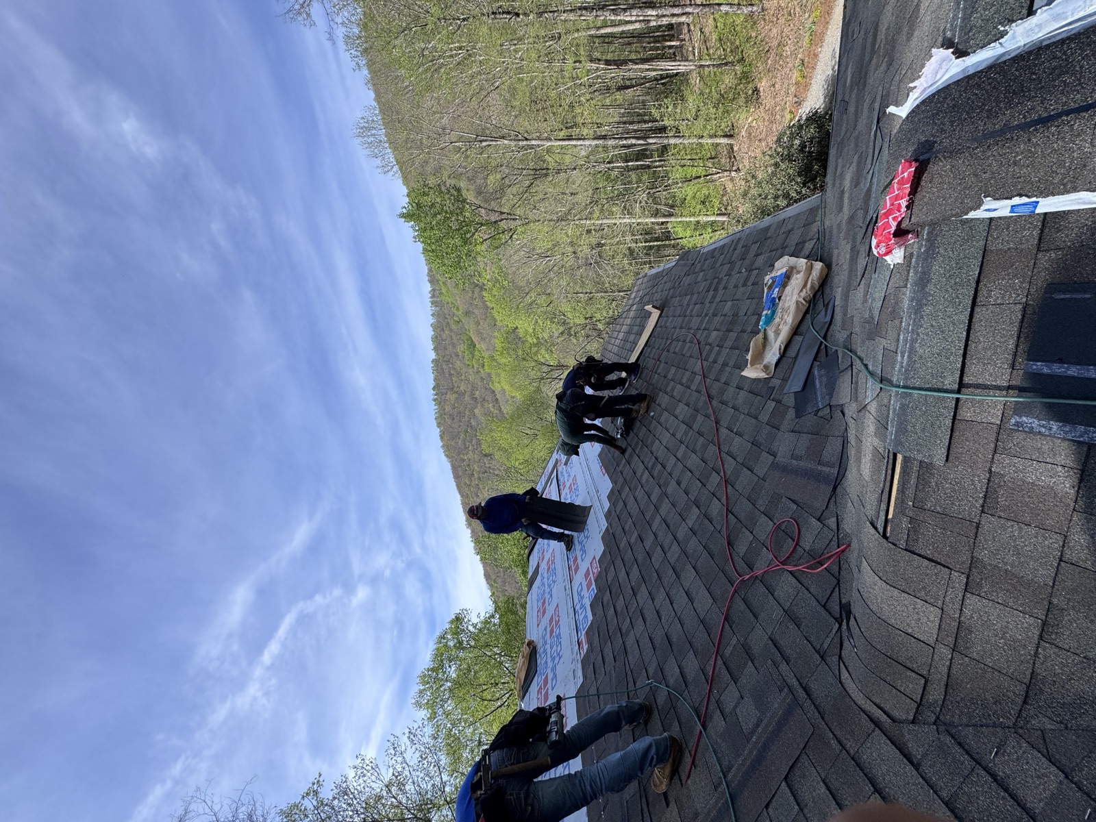 HB Contracting roofers installing a new roof system