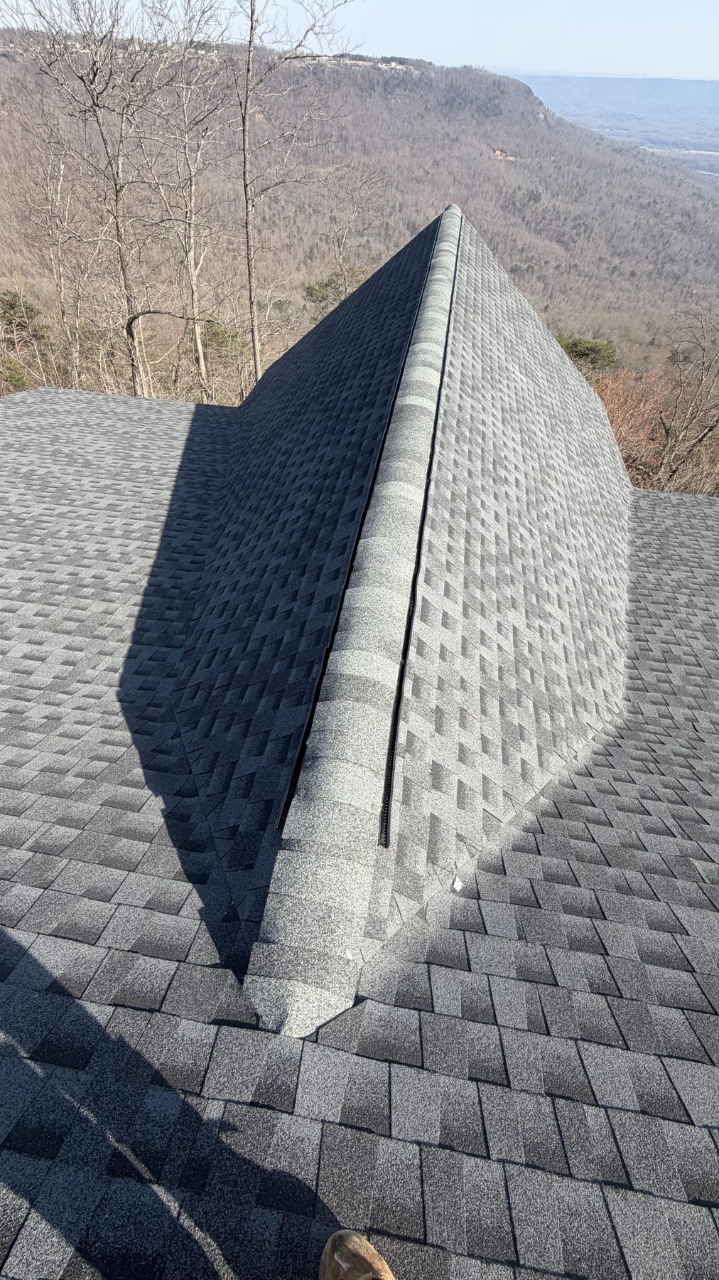 Finished architectural shingle roof installed by HB Contracting overlooking the Tennessee mountains